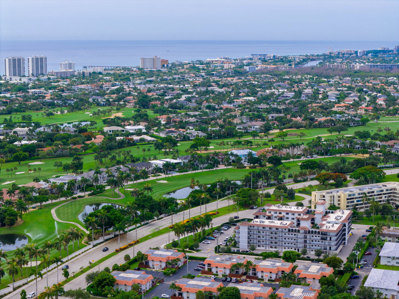 Aerial image Boca Raton Florida. View of homes on golf courses and tropical palms